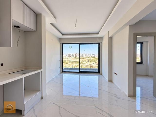 KARACAÖRENDE SOSYAL DONATILI SİTE İÇERİSİNDE SATILIK SIFIR 2+1