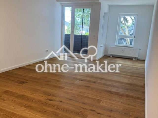 Komplett sanierte 2 Zimmer Wohnung mit Balkon, Einbauküche und Tiefgaragen Stellplatz