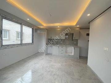 Kozan~yolu~caddeye~yürüme~mesafesi~1+1~az~katlı~geniş~oturumlu