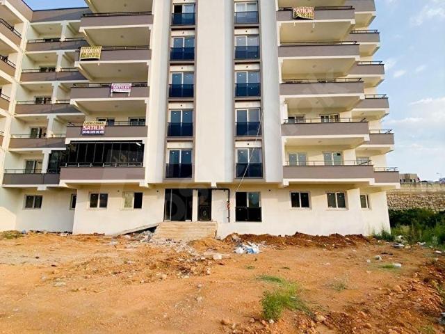 KOZAN DİVAN EMLAK'TAN IŞIKLI YOLA KOMŞU SIFIR DAİRE