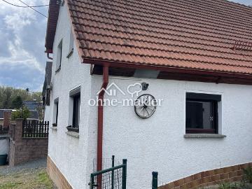 Kleines Haus mit Garten und Blick auf die Mulde