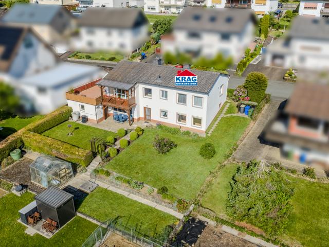 KRAG Immobilien + Viel Platz für große Familien mit Garten und zwei Wohnebenen