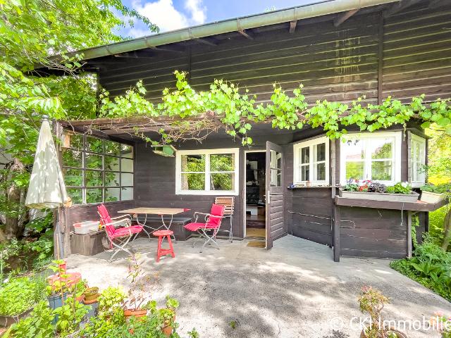 Krailling im Würmtal Charmantes Isartaler Holzhaus auf sonnigem Südwest Grundstück mit Potenzial