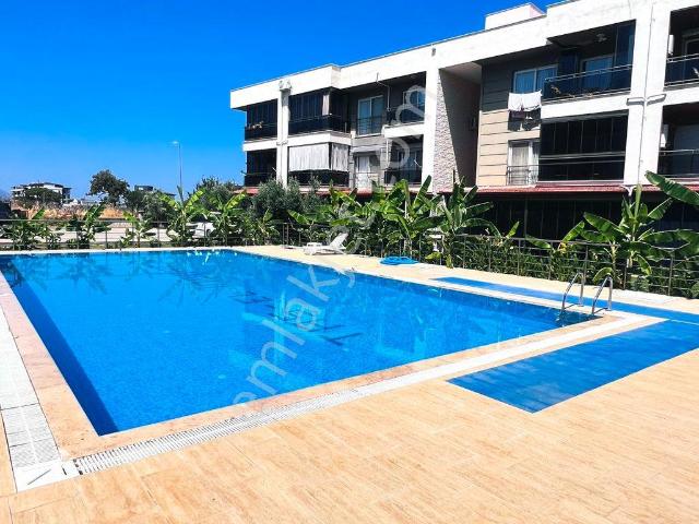 Kuşadası Davutlar’da Havuzlu, Full Manzaralı, Denize Ve Konuma Yakın 1+1 Satılık Daire