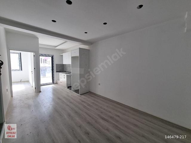 Kuşadası Davutlar'da Merkezi Konumda Sıfır 1+1 Daire