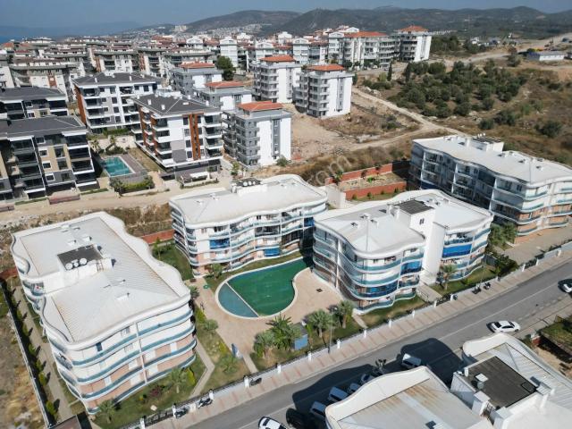 Kuşadası Değirmendere'de Havuzlu Sitede Kiralık 1+1 Daire