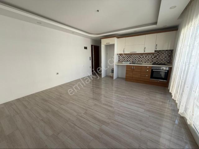 Kuşadası İkiçeşmelik Mahallesinde Boş Kiralık 1+1 Daire