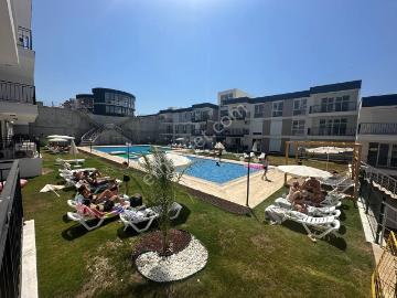 Kuşadası Kirazlı Da Sıfır Havuzlu 2 Artı 1 Ebeveyn Banyolu Satılık Daire