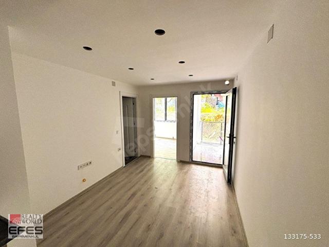 KUŞADASI DAVUTLAR'DA SIFIR, ÖZEL BAHÇELİ 1+1 SATILIK DAİRE