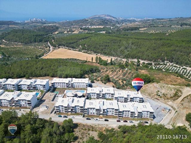 KUŞADASI EŞİN VADİ SİTESİNDE SATILIK 1+1 DAİRE