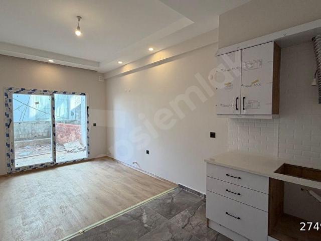 KUŞADASI GÜZELÇAMLIDA SATILIK SIFIR YAPIM BAHÇELİ 1+1 DAİRE
