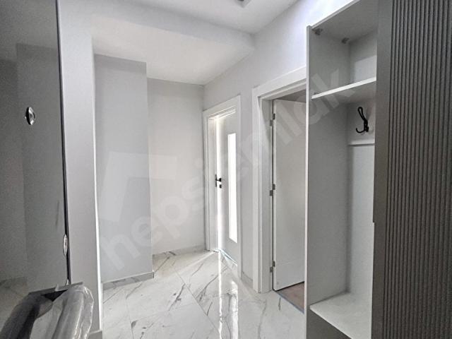 KUM MAHALLESİNDE ELMALI YOLU ÜZERİNDE SATILIK 1+1 DAİRE