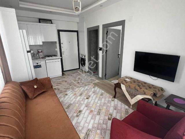 Kulepark~farkıyla~çok~geniş~40~m2net~oturumlu~1+1~eşyalı~satılık