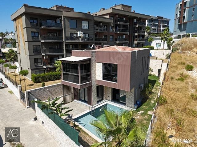 KUSADASINDA SATILIKÖZEL HAVUZOTOPARKYERDEN ISITMALÜX480 M2 BAHÇEFULL ESYALITAMAMI MÜSTAKİL