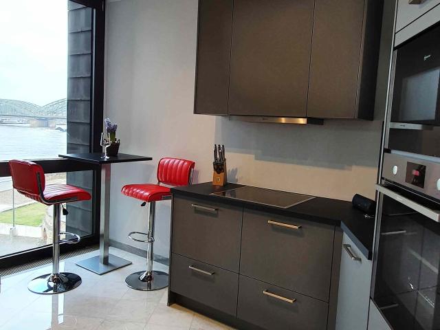 Landmark Building Top interior design fully furnished directly on the river Rhine and view to the Cologne Cathedral, Koln Amsterdam Apartments for Rent