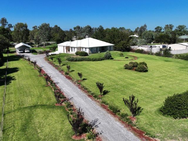 Landscaped Acreage With Modern Brick Home