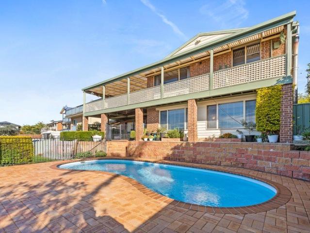 Lake Views, Pool & Dual Living Potential