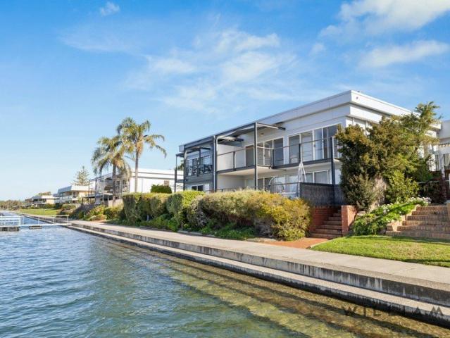 LAKEFRONT LIVING WITH ENDLESS OPPORTUNITY
