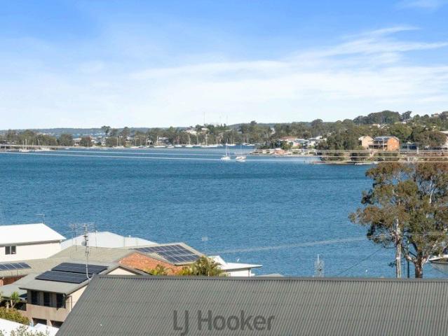 Lakeside Living with Endless Potential & Stunning Views