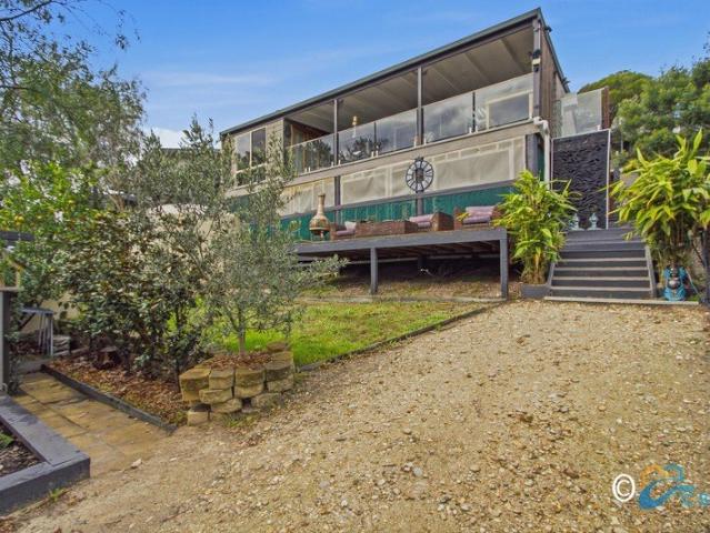 LAKESIDE LIVING WITH POTENTIAL