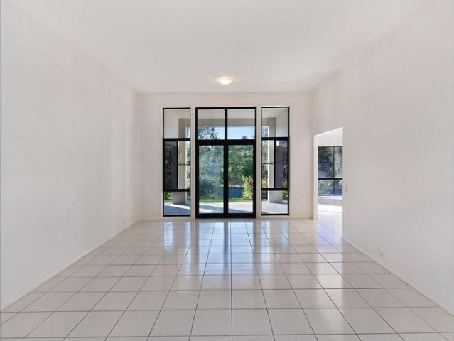 Lakeside Luxury and Grand Scale in a Premium Palmwoods Enclave