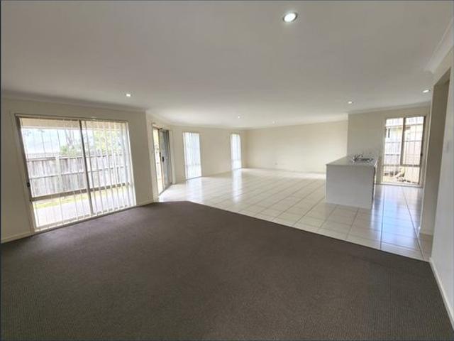 LARGE 4 BEDROOM FAMILY HOME WITH OPEN KITCHEN LIVING DINING THAT OPENS OUT ON TO ALFRESCO DINING AREA. DOUBLE GATED SIDE ACCESS