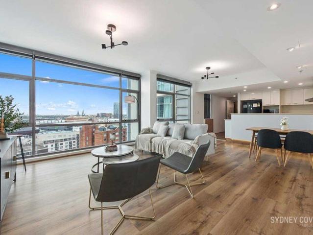LARGE THREE BEDROOM + STUDY RESIDENCE WITH SWEEPING CITY SKYLINE VIEWS