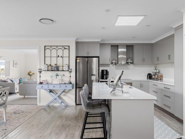 Large family home, multiple living rooms and side access with scope for additional garaging STCA