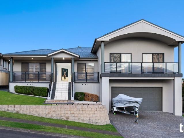 Large Scale Family Living with an Outdoor Kitchen Raising the Bar