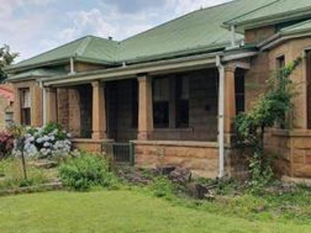 large sandstone home