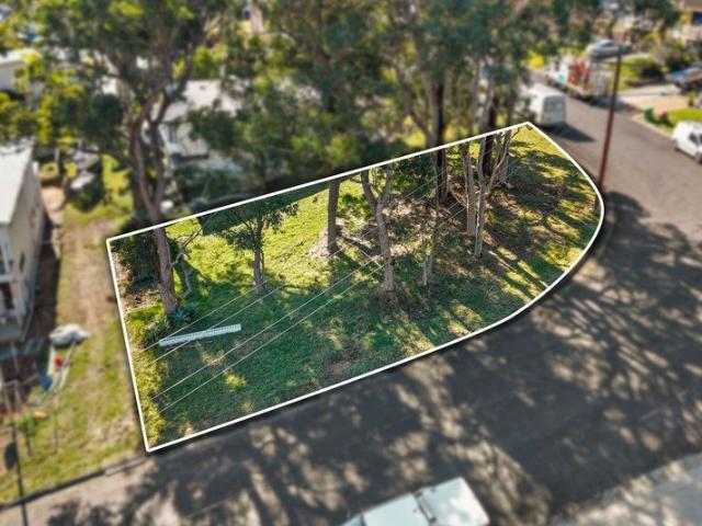 Last Remaining Lakeside Corner Block with Water view potential!
