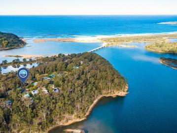 LEAFY COASTAL RETREAT WITH OCEAN & INLET VIEWS