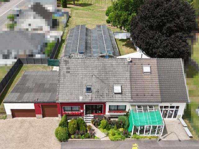 Leben und Arbeiten unter einem Dach – vielseitiges Wohn und Geschäftshaus mit Gartenidylle