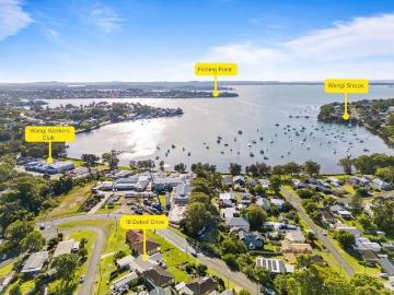 LEVEL HOME WITH LAKE VIEWS AND TWO STREET FRONTAGE RIGHT NEAR THE LAKE