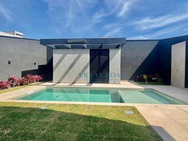 Linda casa em condomínio de alto padrão com 4 suítes!