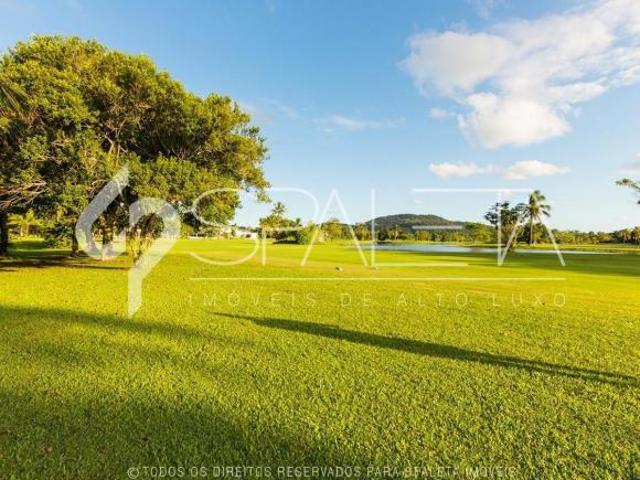 Lindíssima residência com golfe no quintal e vista sensacional para o lago à venda no Guarujá Golf C