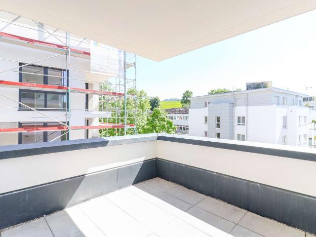 Lichtdurchflutete Wohlfühloase mit moderner Wohnküche und sonnigem Balkon in großzügigem Ambiente