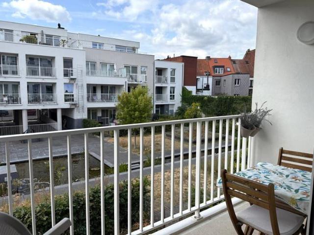 Lichtrijk 1 slaapkamerappartement met terras en parking