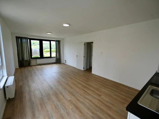 LICHTRIJK INSTAPKLAAR APPARTEMENT MET DUINENZICHT EN GESLOTEN GARAGEBOX