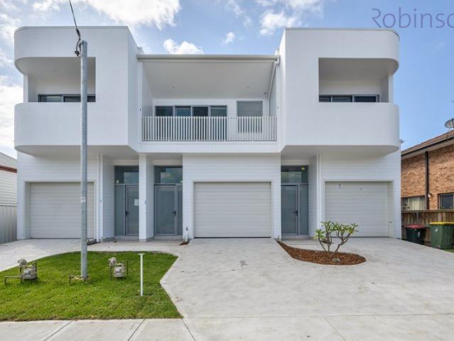Lifestyle and location with this brand new three bedroom townhome moments to Merewether beach