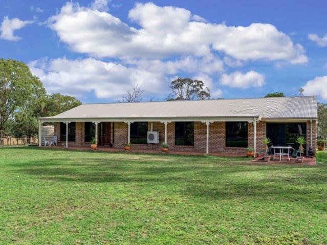LIFESTYLE ACREAGE WITH SPACIOUS FAMILY HOME, SHEDS, & QUALITY WATER SUPPLY