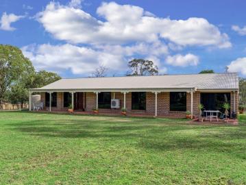 LIFESTYLE ACREAGE WITH SPACIOUS FAMILY HOME, SHEDS, & QUALITY WATER SUPPLY