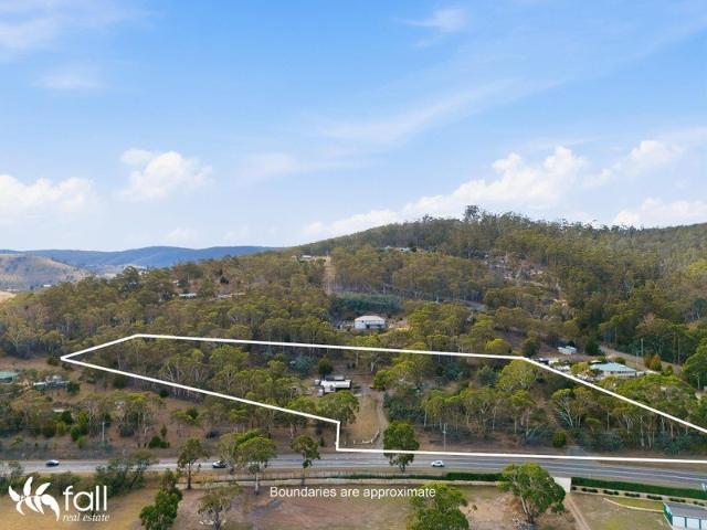 Water Views, Acreage & Endless Lifestyle Potential