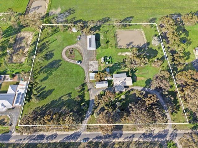 Lifestyle Living with Exceptional Shedding on 4.47 Acres