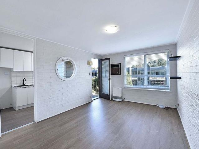 Light Filled Comfort in a Prime Location!