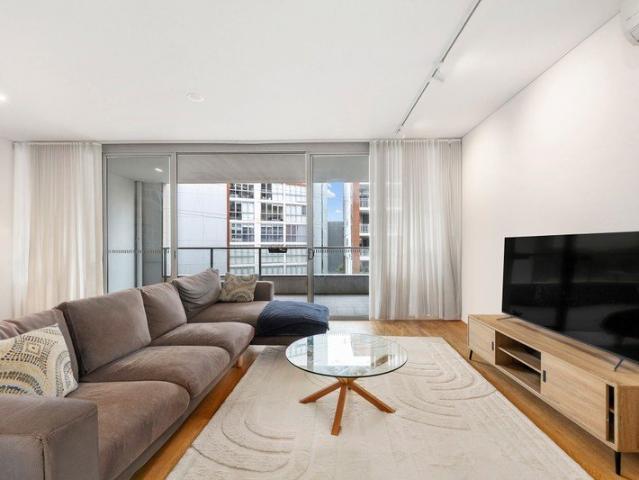 Light filled contemporary living with dual balconies