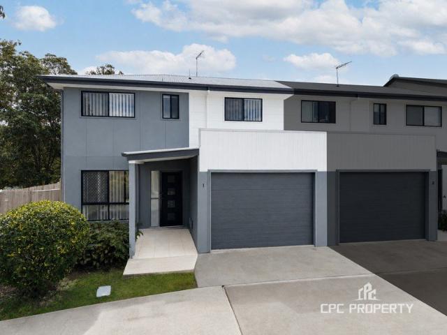LIGHT FILLED CORNER TOWNHOUSE IN THE SOUGHT AFTER COMPLEX