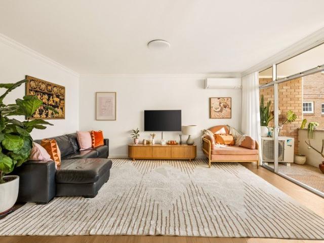 Light filled and low maintenance village living with two balconies