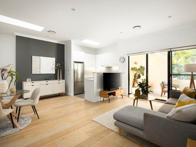 Light filled apartment with triple garage in a sought after position