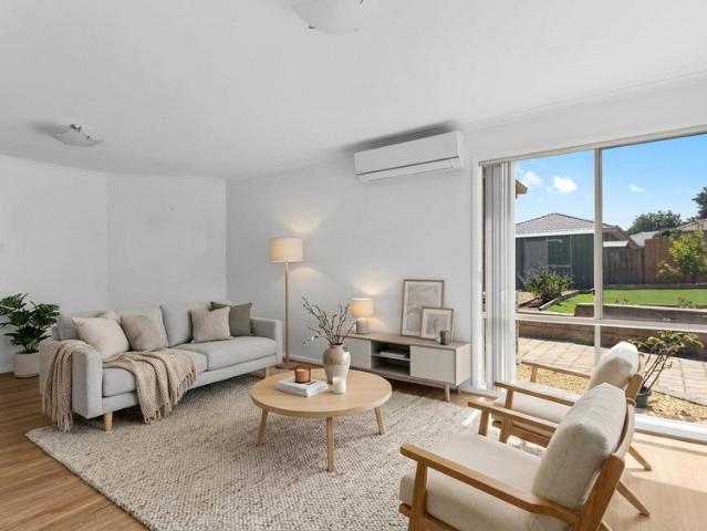 LIGHT FILLED FAMILY HOME WITH TWO LIVING AREAS!